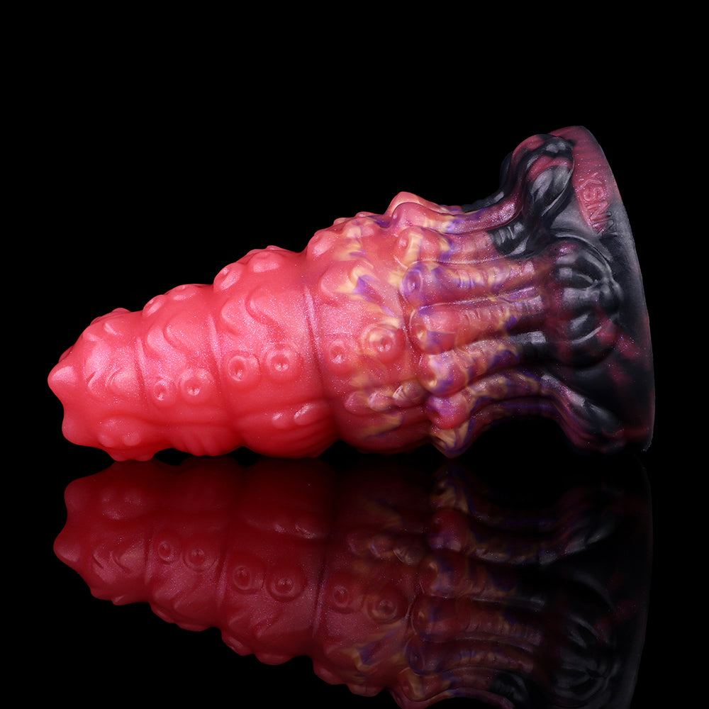 Side profile: glossy pink alien butt plug with marbled purple and dark ribbed tip