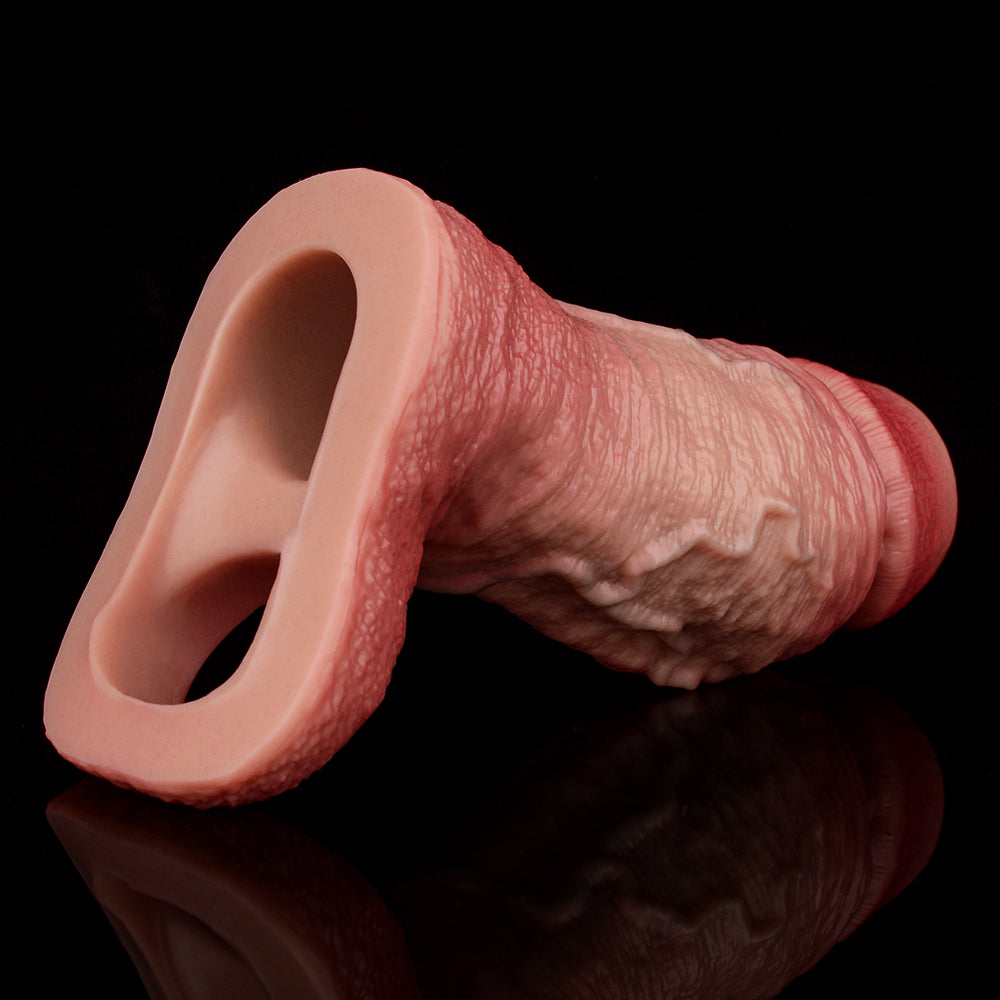 Realistic penis sleeve extender, pink ring opening on one end, textured surface