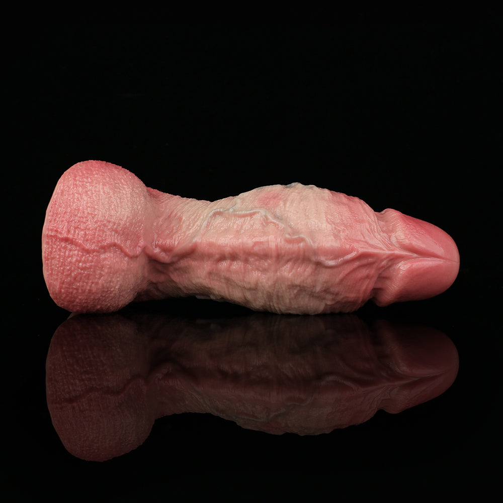 Pink realistic penis dildo close-up, molded texture and smooth rounded tip
