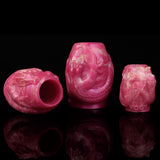 Dragon-knot penis sheath extender in pink, textured sleeve with open end