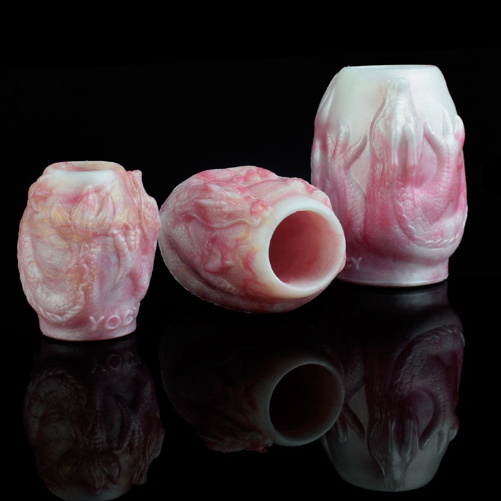 White and pink dragon-knot penis sheath extender, open-tip textured sleeves