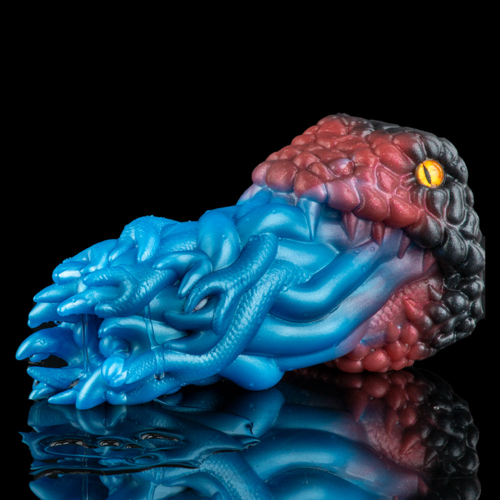 Textured silicone toy with blue ridged channel and maroon ribbed top, oval black base