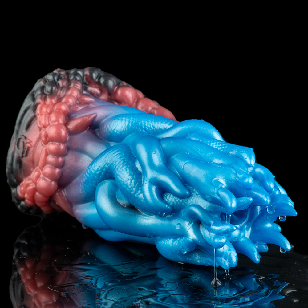 Side view of two-tone textured silicone toy, blue ridged front and maroon ribbed back