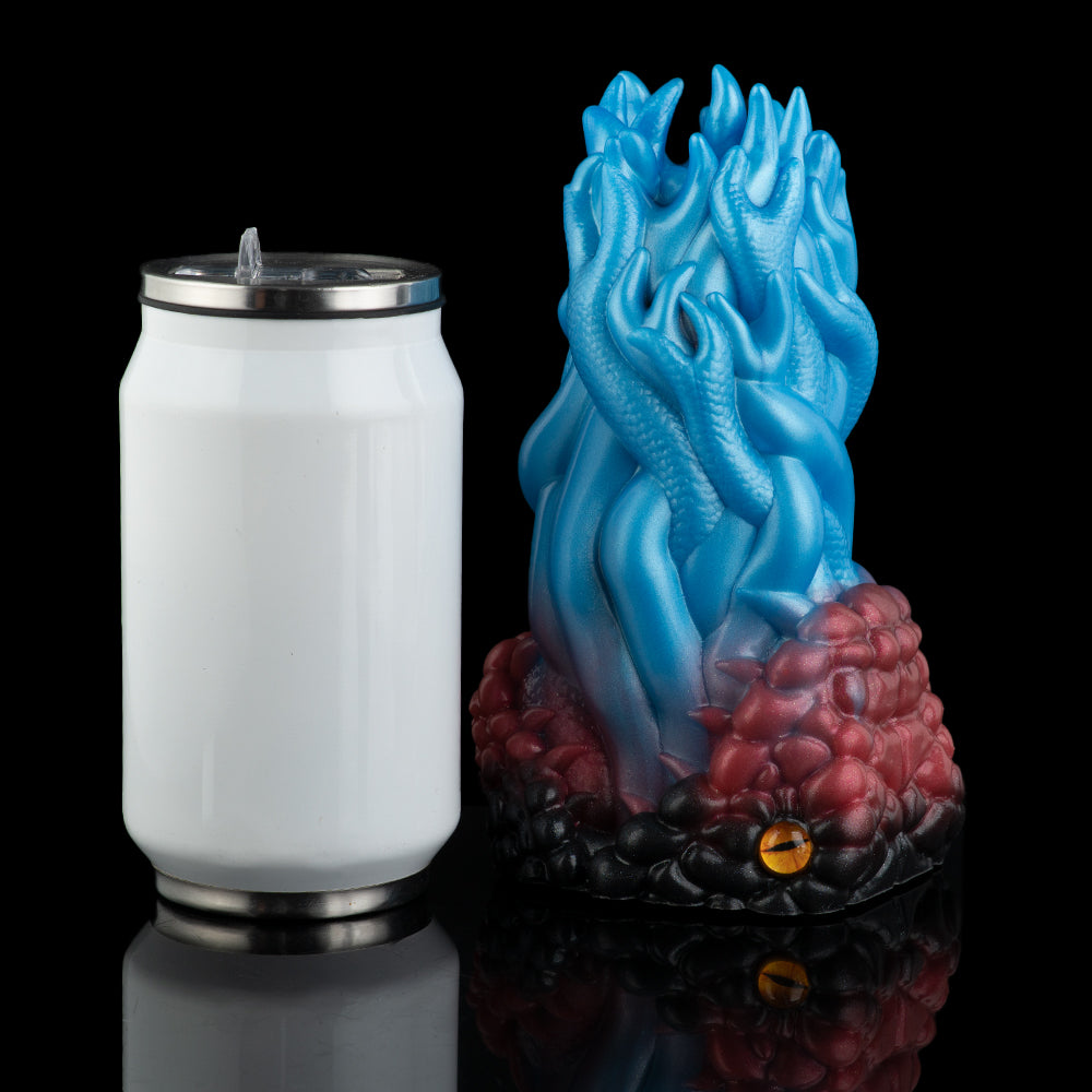Two-tone textured silicone toy with ridged blue tip and maroon body, silver base ring