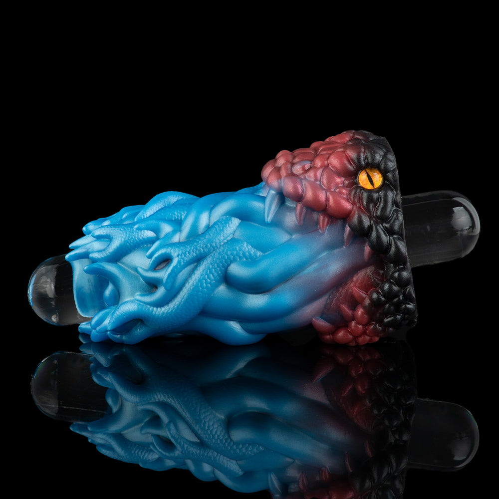 Two-tone textured silicone toy with blue ridged front and maroon ribbed back, clear insert tips