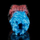 Front view of textured silicone toy with blue ridged middle and maroon ribbed outer sections