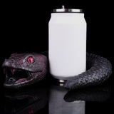 Serpentress Fleshlight snake-head toy beside a white dispenser bottle