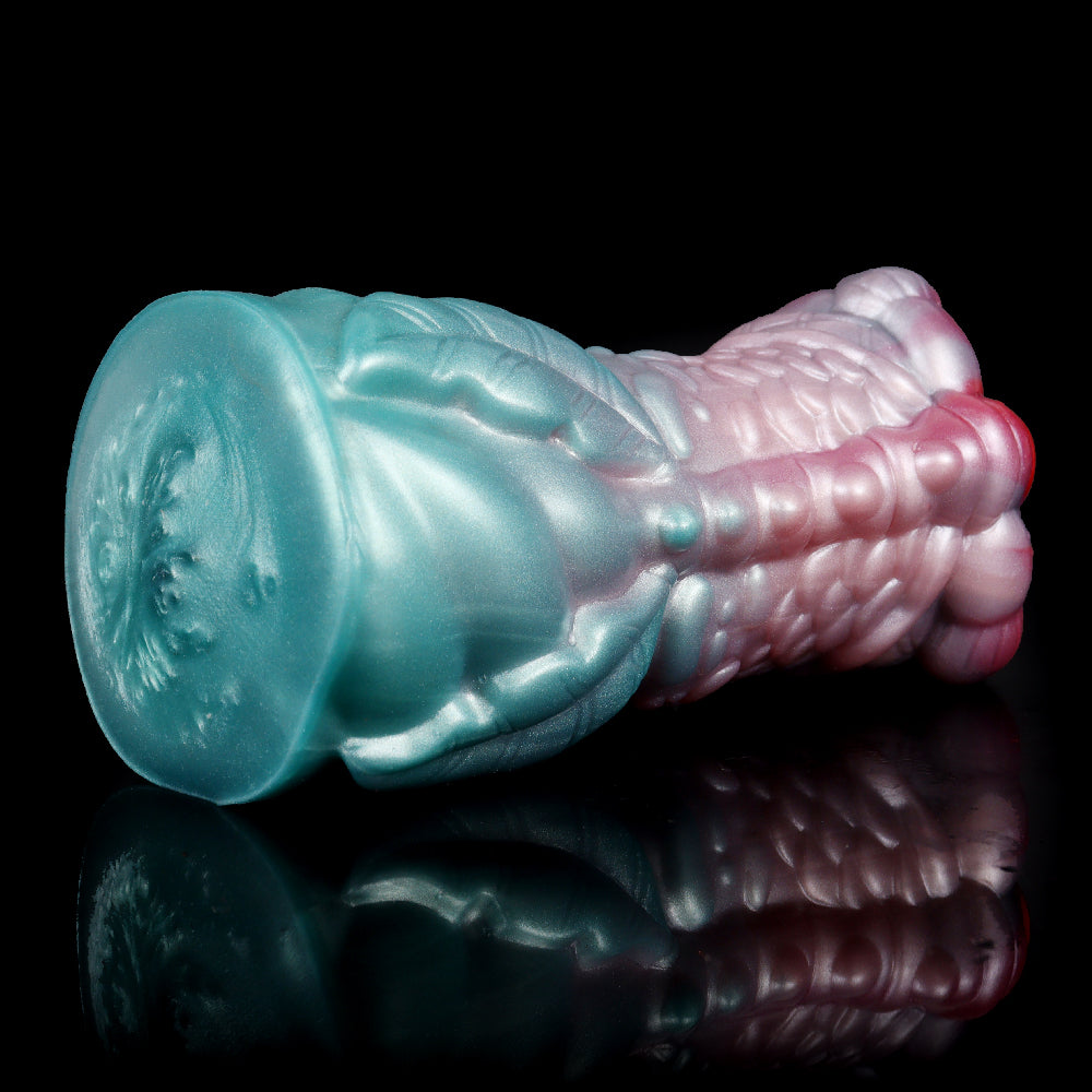 Teal and pink dragon fantasy masturbator with bulb-shaped end and scaly pattern