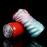 Dragon fantasy masturbator with teal tail, red motor base, and textured scales