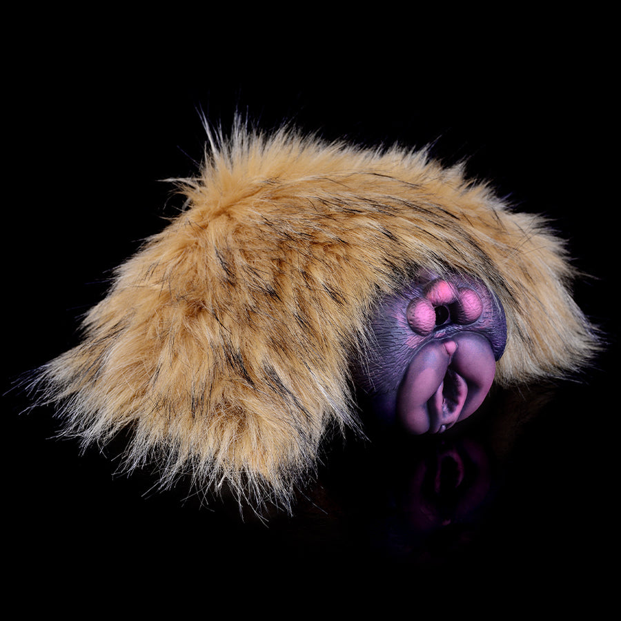 Tan faux-fur sleeve with close-up of black dual openings and pink insert detail