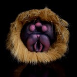 Furry two-hole stroker, front view with twin openings inside plush rim
