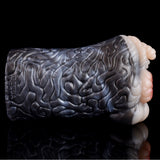 Realistic animal fleshlight, top view of dark gray ridged texture
