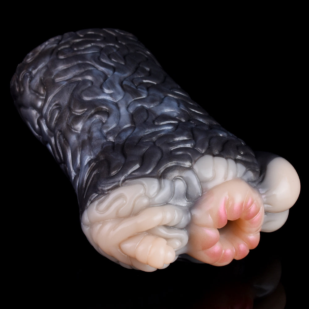 Realistic animal fleshlight, angled view of dark gray textured surface and paw tip