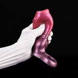 Dog penis sleeve in metallic pink on gloved hands, knot base and front texture