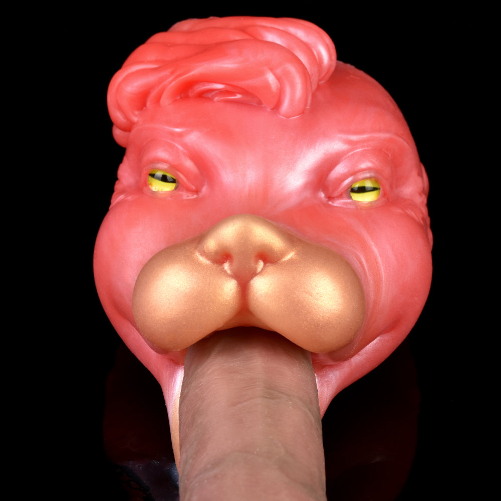 Pink/red creature head close-up with yellow-green eyes and bulbous snout