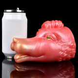 Pink/red creature fleshlite lying down with yellow-green eyes; close side view