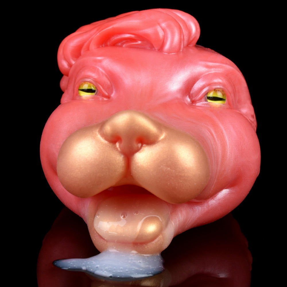 Pink/red creature head with yellow-green eyes, detailed snout and small blue tip