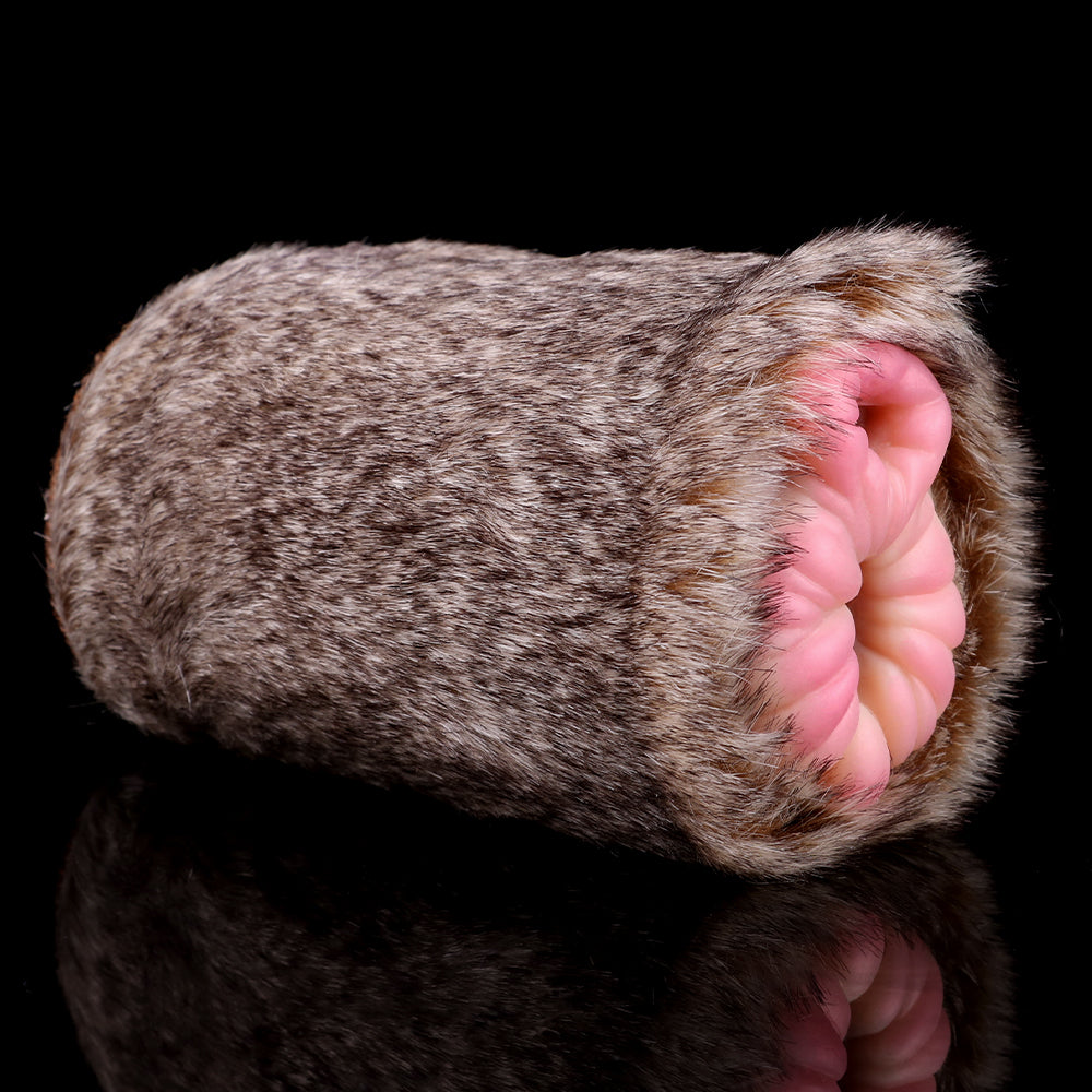 Gray-brown furry stroker with pink insert visible at the end