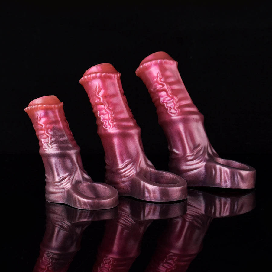 Silicone horse penis sleeve, pink metallic, three upright views on black surface