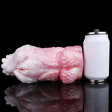 Squid-shaped fleshlight with textured body in pink/white, next to measuring cup