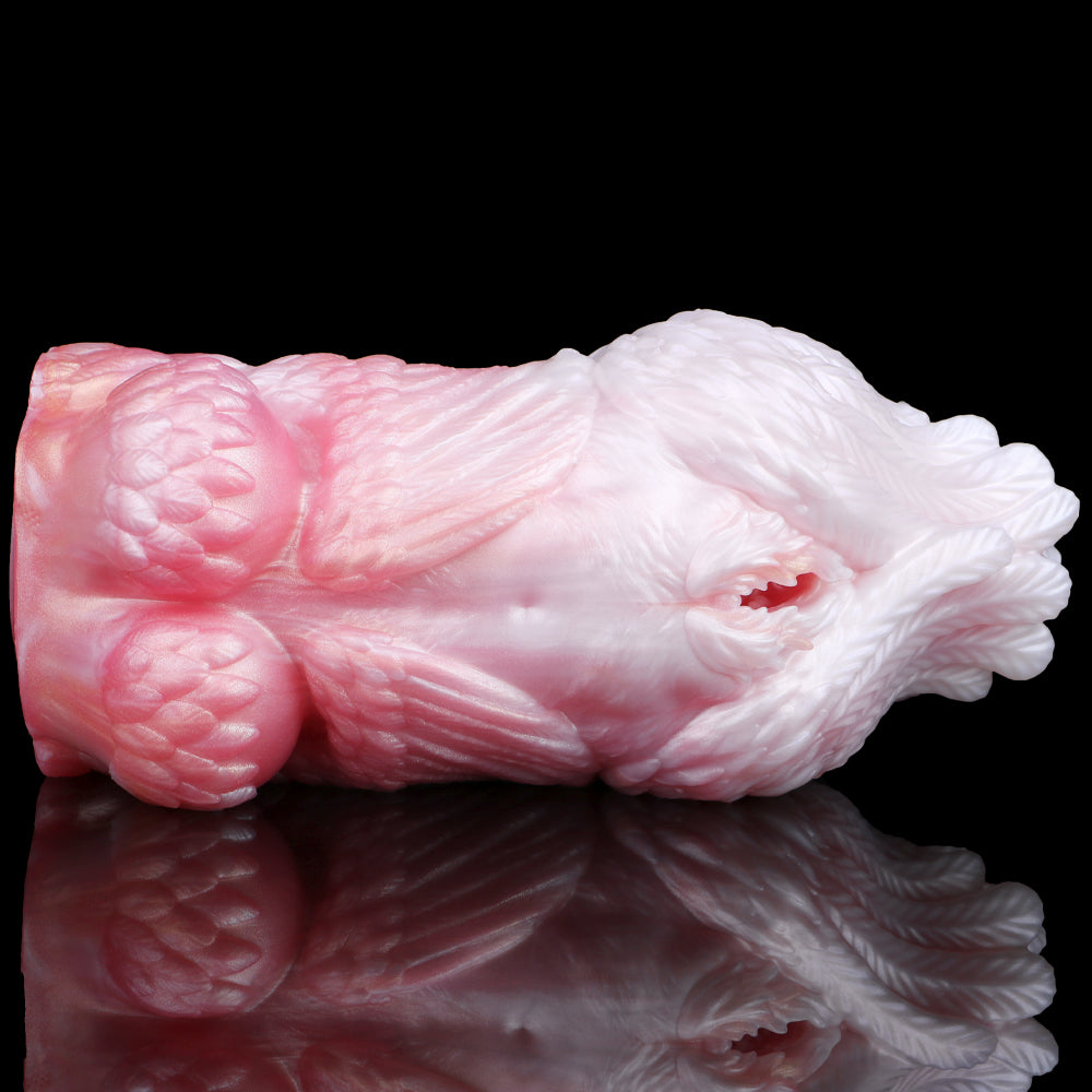 Squid-shaped fleshlight, pink and white, top view with inner opening on side