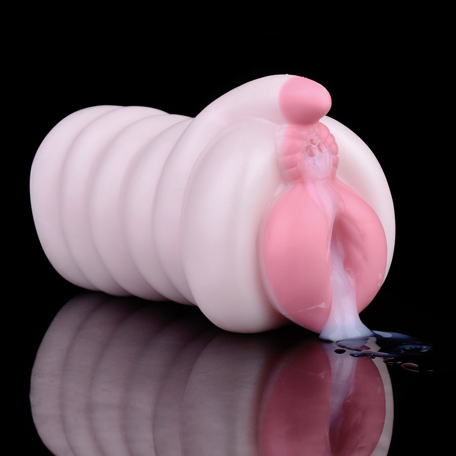 Pig-themed masturbator with ribbed sleeve and rounded pink tip, light flesh color