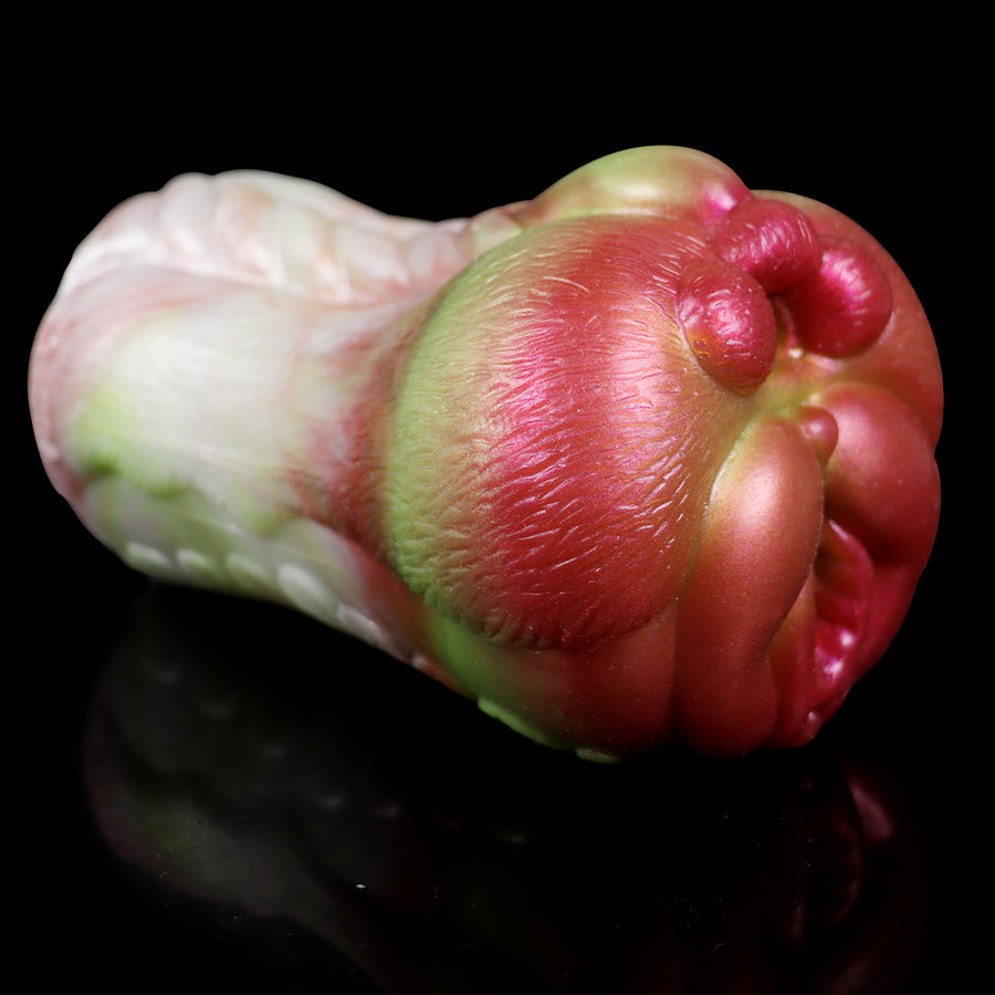Dog-shaped masturbator close-up, rear nub and underside, pink, green, and white