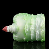 Green silicone butt plug with pink insert tip, rear side view with ribbed texture.