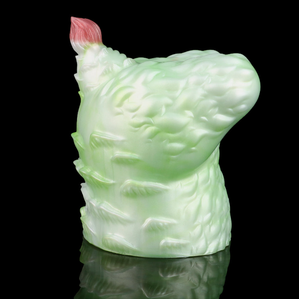 Green silicone butt plug with pink insert tip, side view showing ridged surface.