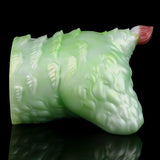 Green silicone butt plug with pink tip, back view with ridged molded details.