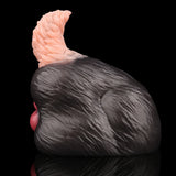 Side view of tailless dog sex toy: black textured body with pale pink top