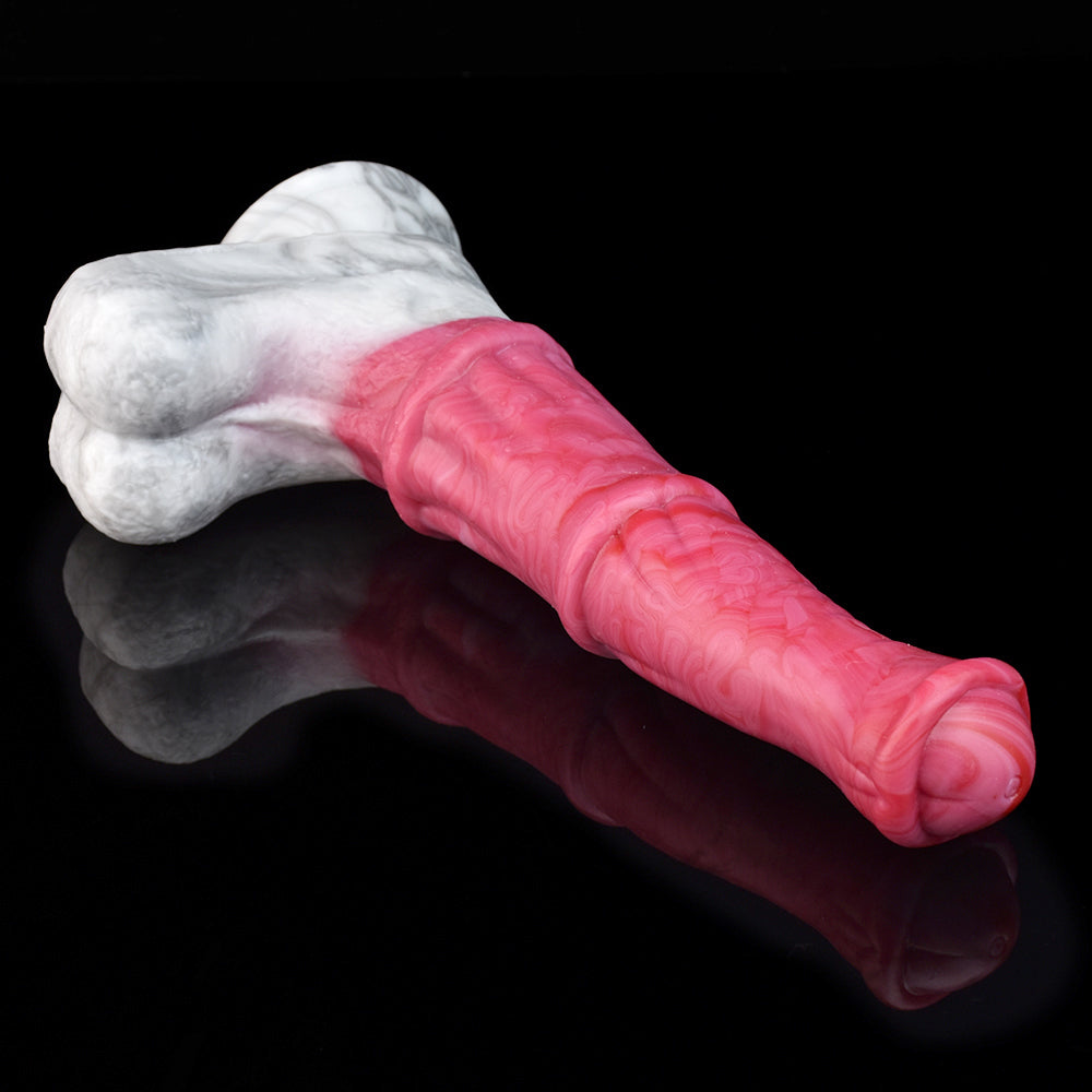 Pink vibrating dildo with marbled white base, held in a hand