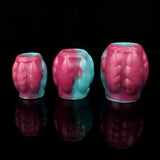 Teal and pink dragon knot sheath sleeve extender, three pieces shown with open ends