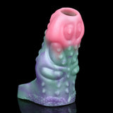 Octopus cock sleeve sheath close-up; raised tentacle bumps in pink, green and purple