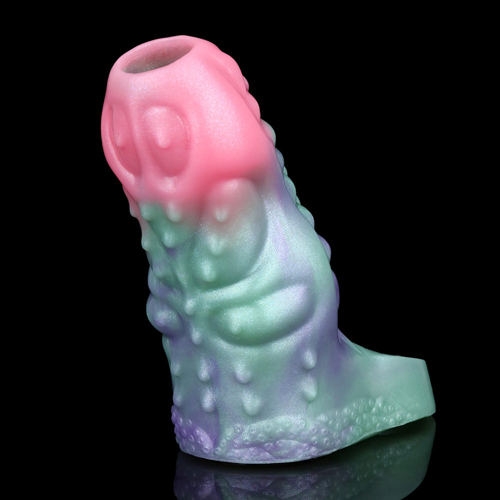 Octopus cock sleeve sheath angled close-up; pink top, green body, purple lower pattern