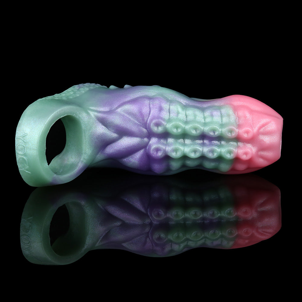 Octopus cock sleeve sheath, side view; translucent iridescent pink/green/purple ring end