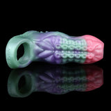 Octopus cock sleeve sheath, side view; translucent iridescent pink/green/purple ring end