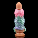 Octopus cock sleeve sheath, side view; pink cap, green midsection, open ring base