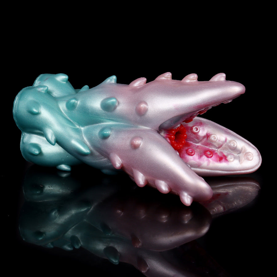Teal and pink monster stroker sleeve with ridged tentacles, side view on base