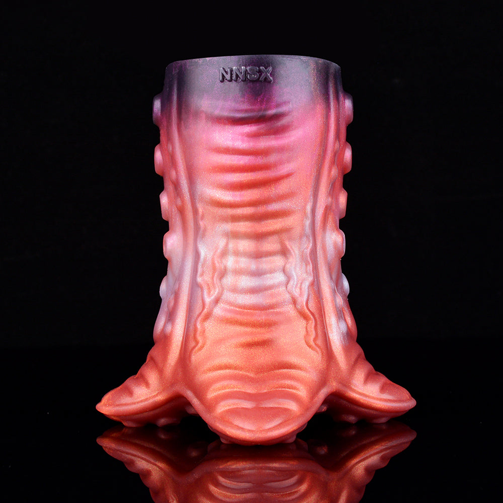 Front view of pinkish-red tentacruel stroker with tentacle skirt detail