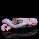Pastel octopus figurine with curled tentacles and small eye, lying on its side