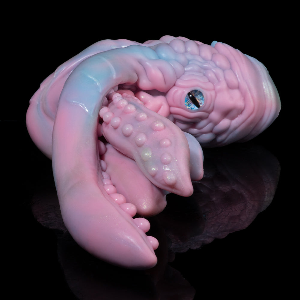 Pastel octopus figurine close-up with blue-green eye and textured tentacles