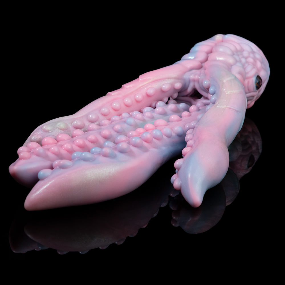 Pastel octopus figurine lying down with curled arms and textured suction dots