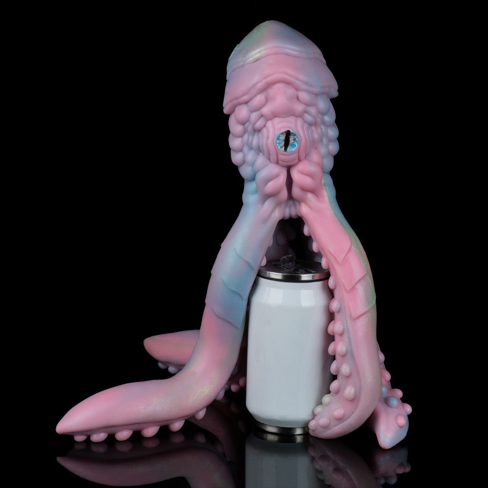 Pastel octopus figurine upright with blue-green eye and side tentacles