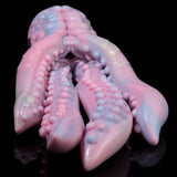 Pastel octopus figurine close-up of head and tentacles with textured bumps