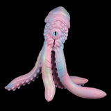 Pink tentacled creature figurine with long arms and open mouth