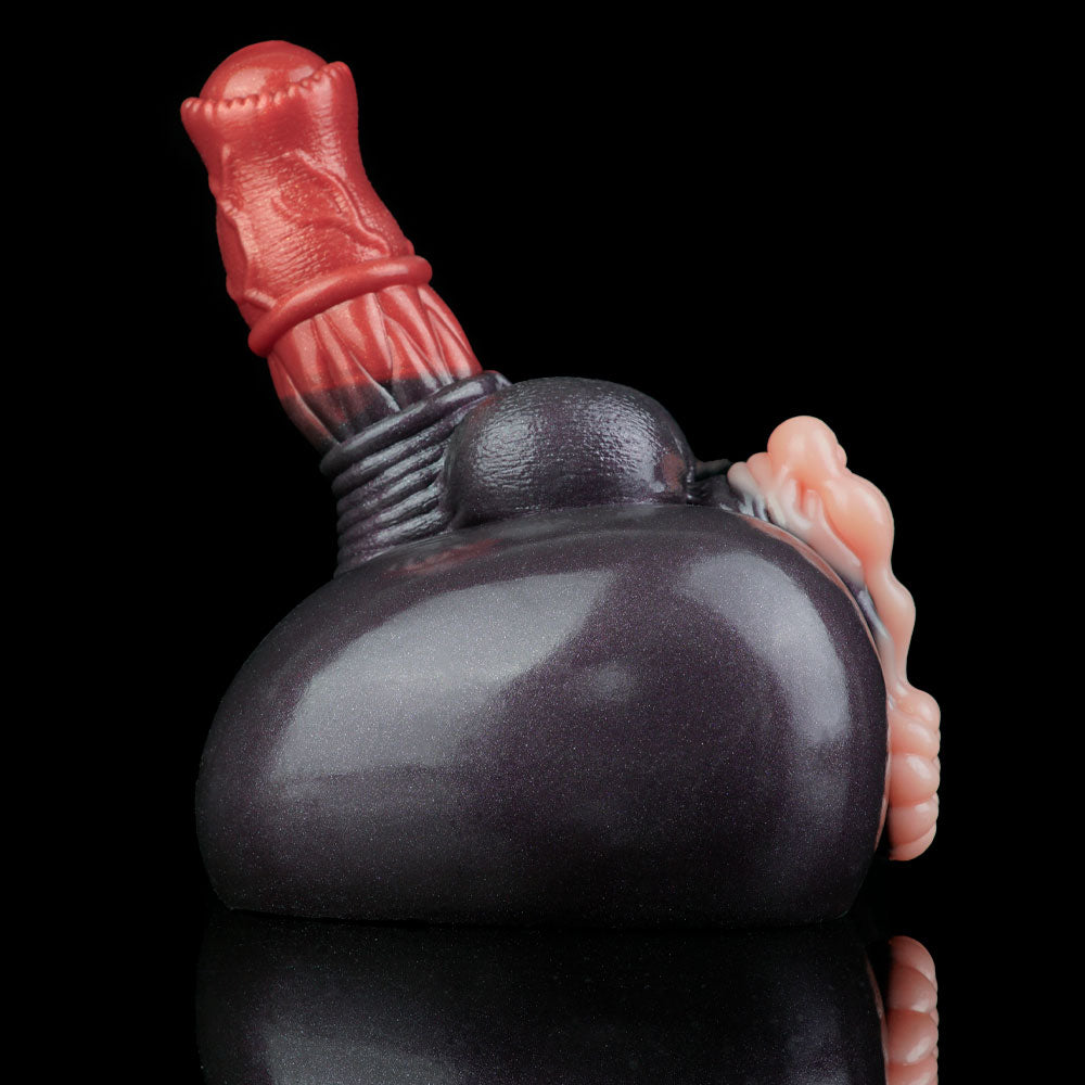 Adult novelty toy side view with dark gray body, red top handle, and pink detail end