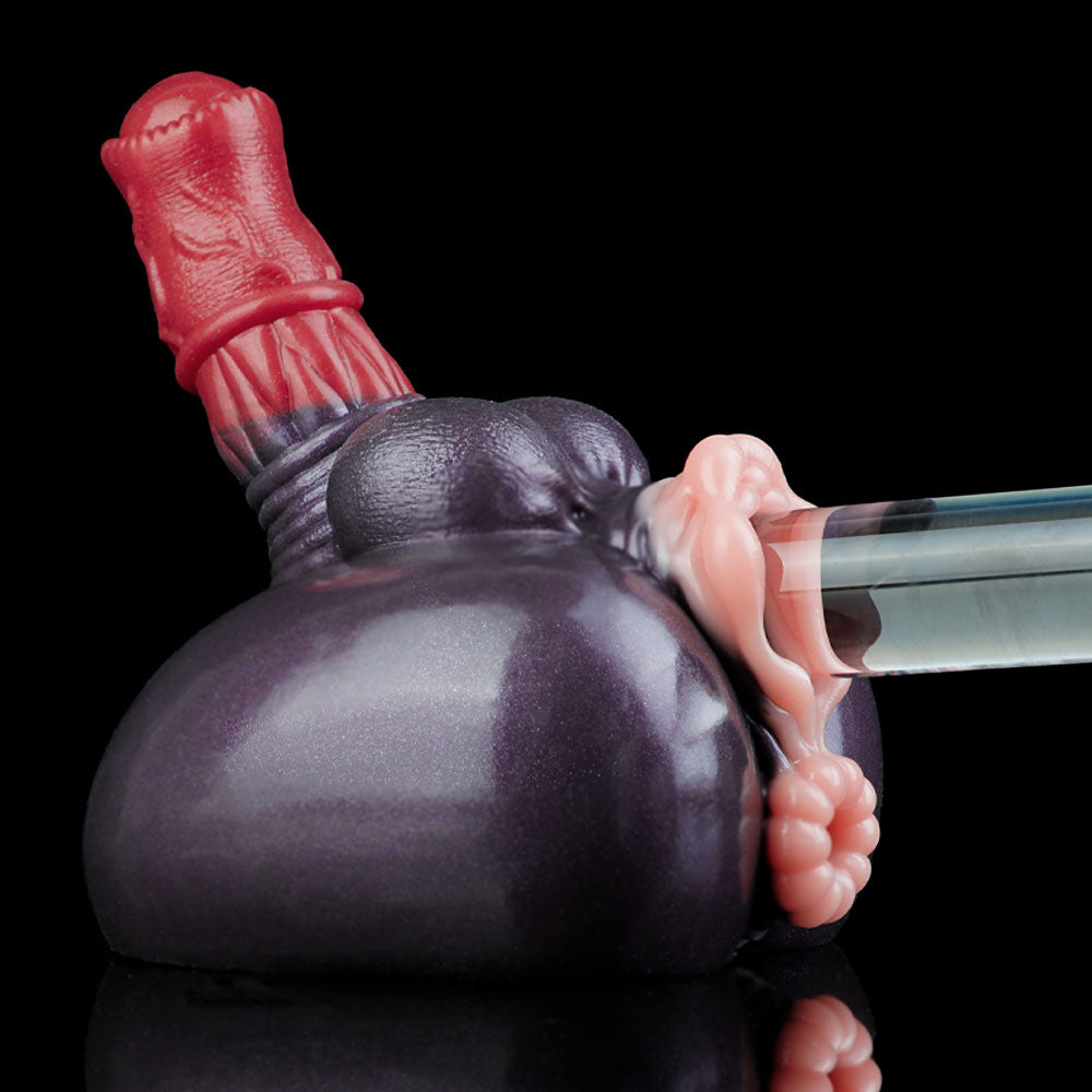 Adult novelty toy angled view with dark gray body, red top, and pink end attachment