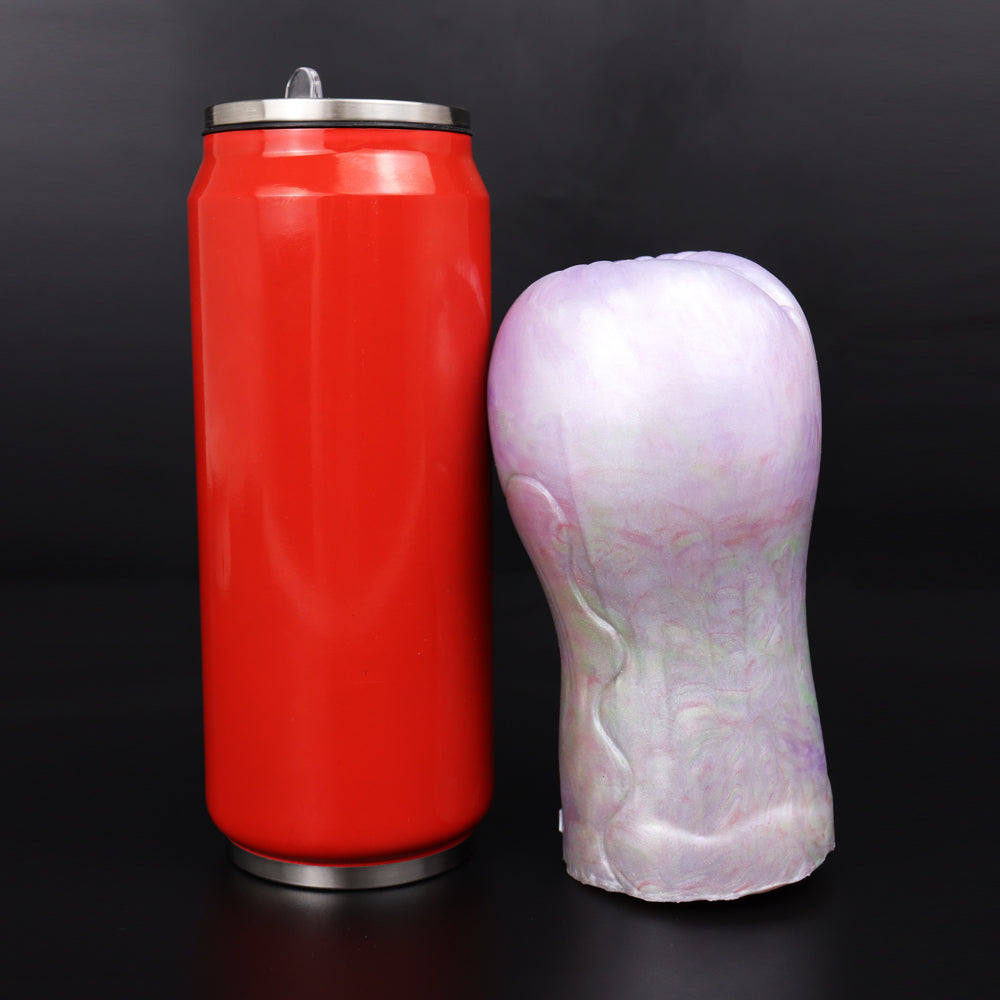 Purple and iridescent masturbator attachment beside red canister with metal top