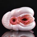 End view of pink two-hole canine stroker with two dark circular openings